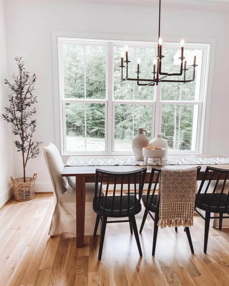 Farmhouse Dining Room With Exposed Windows