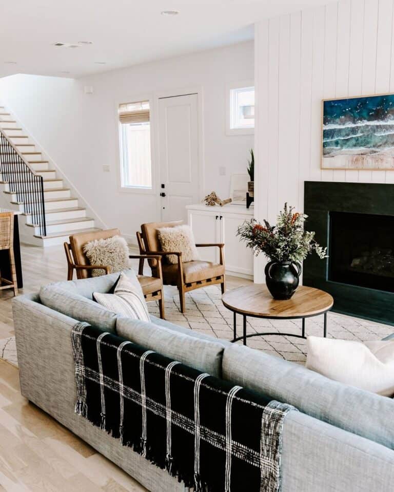 Farmhouse-style Living Room With Checkered Throw Blanket