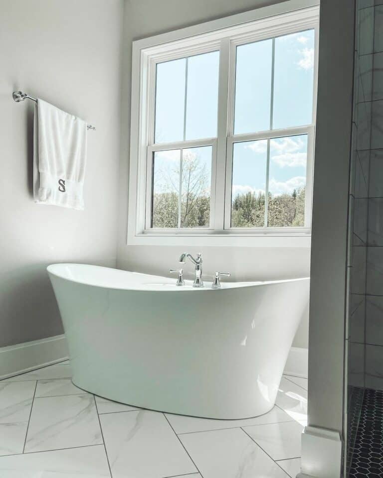 Freestanding Bathtub Surrounded by Beige Walls