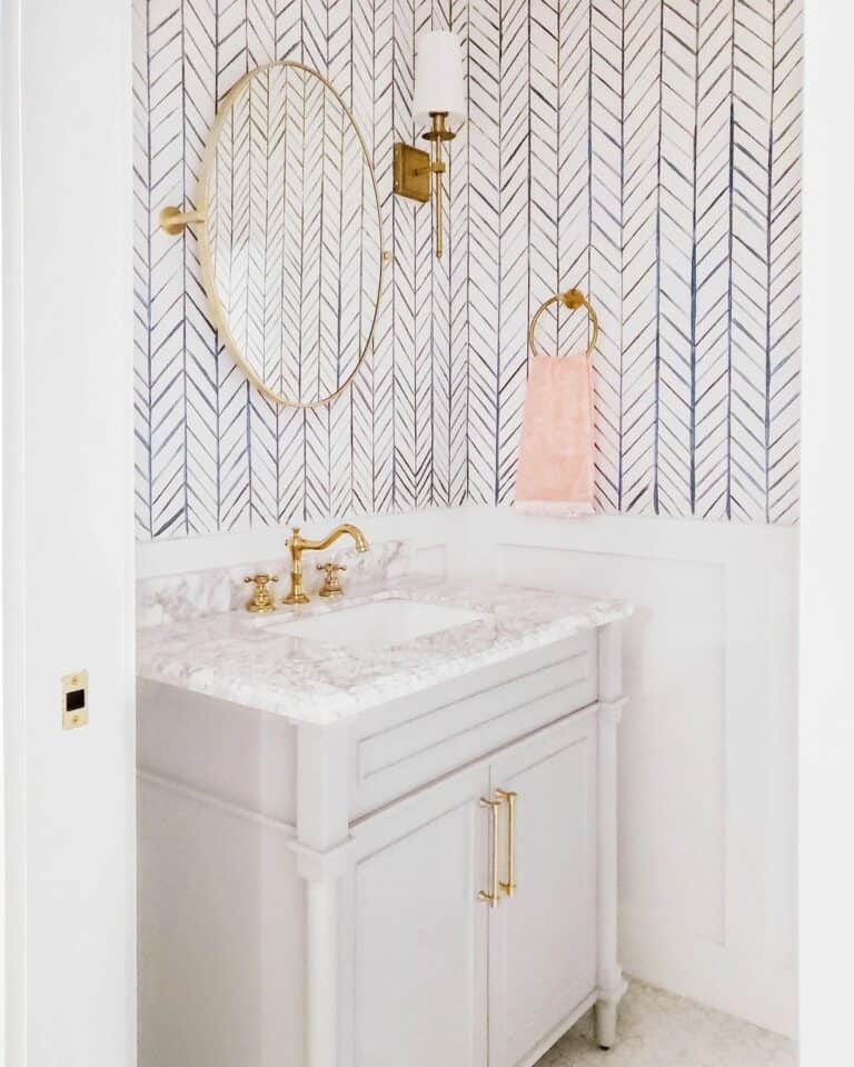 Gold and White Bathroom with Herringbone Walls