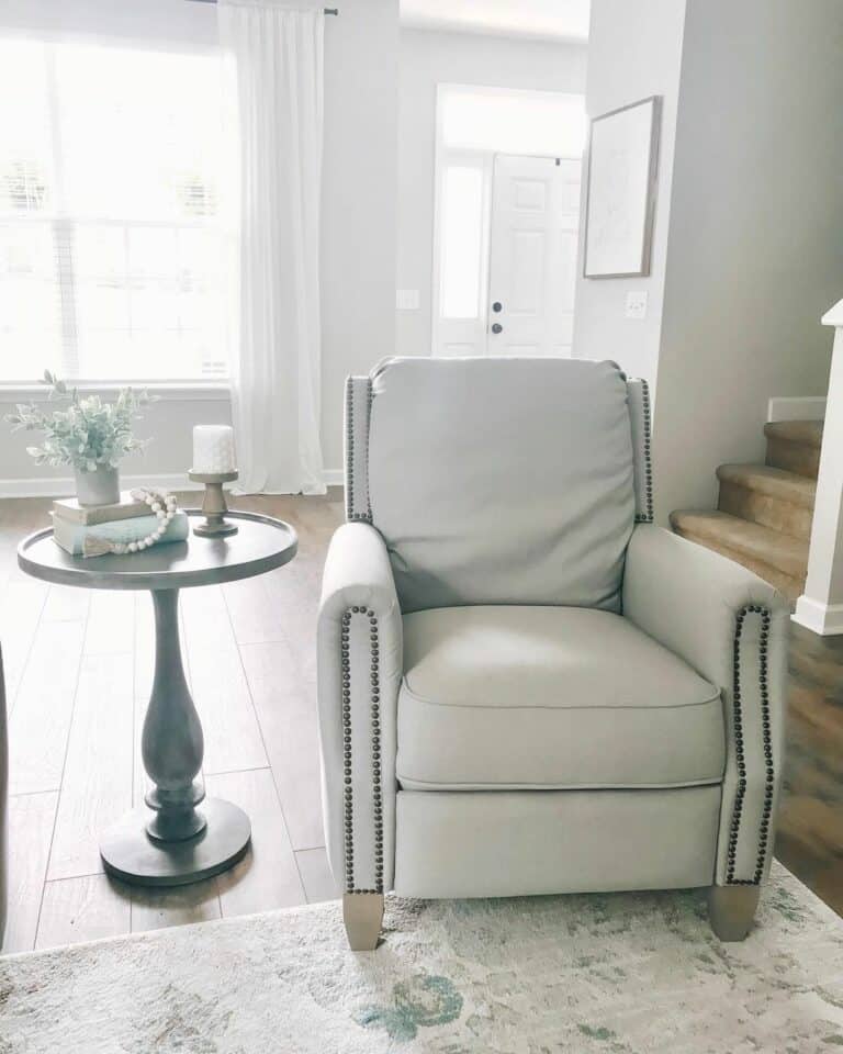 Gray Chair With Round Black Pedestal Side Table