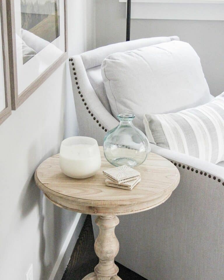 Gray Corner Chair With Round Light Wood Side Table