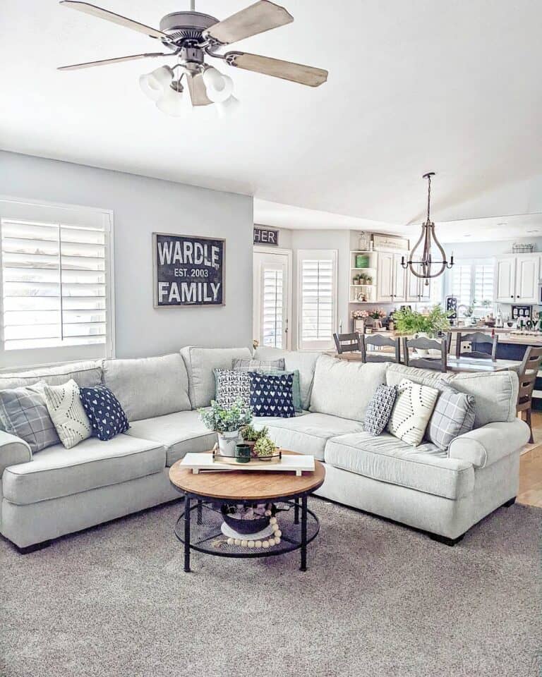 Gray Sectional Couch With Round Wood Coffee Table