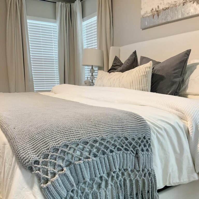 Gray and White Bedroom With Beige Drapes
