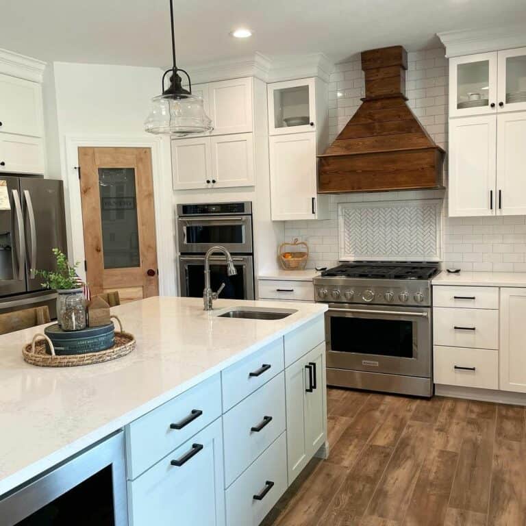 Large White Marble Kitchen Counter With a Rustic Centerpiece