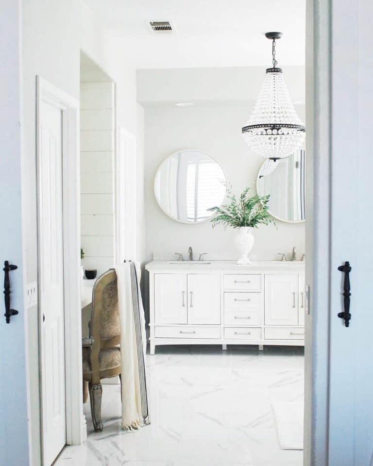 Luxurious White Master Bathroom With a Crystal Chandelier