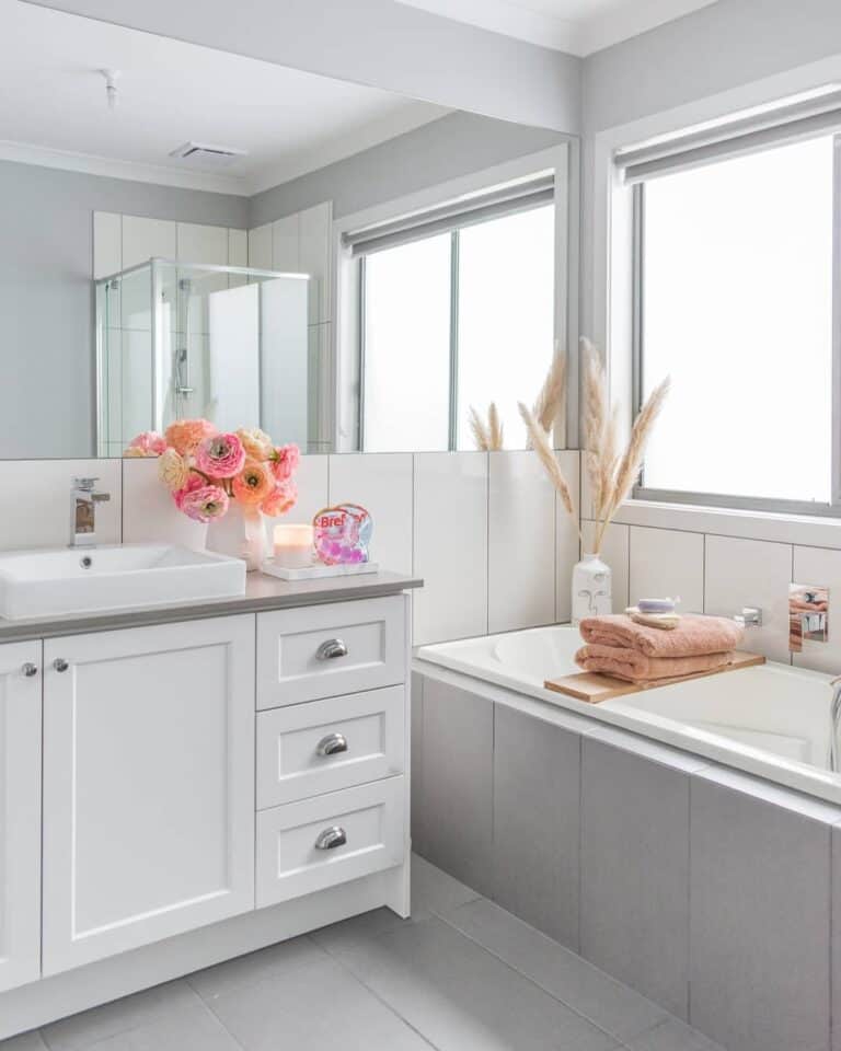 Minimalist White Bathroom With Floral Decorations