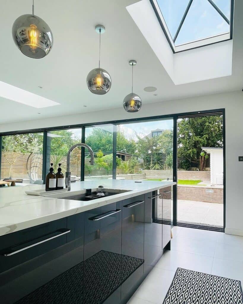 Modern Black and White Kitchen With a Large Skylight
