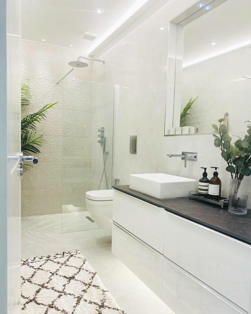 Modern Bright White Farmhouse Bathroom With Greenery