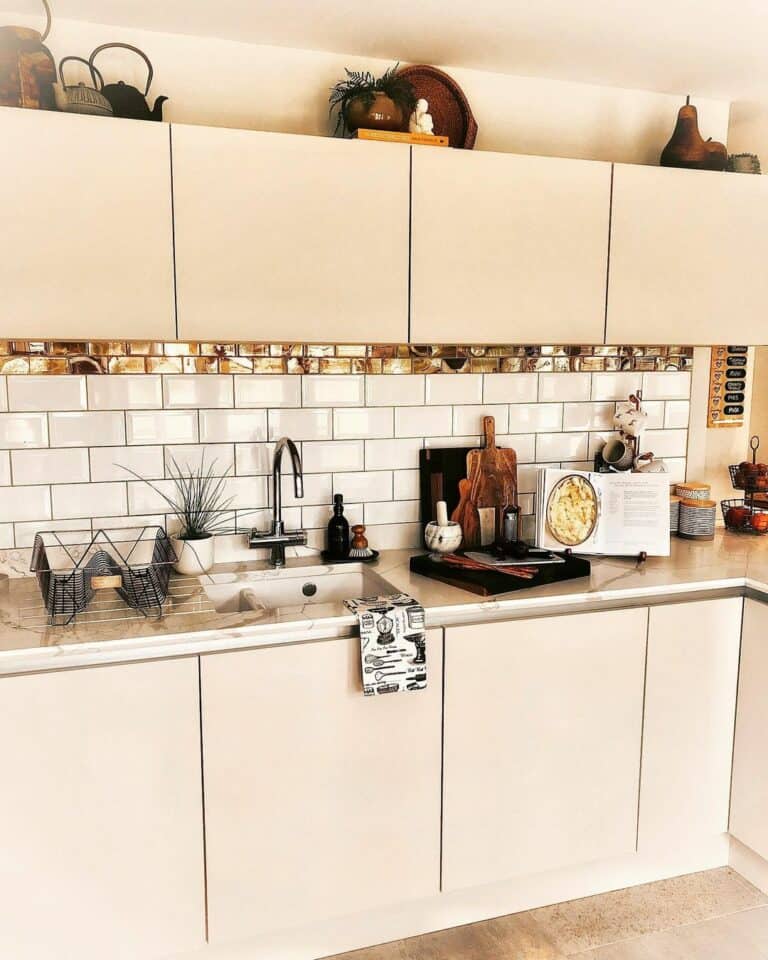 Modern White Kitchen With Marble Counters Utensil Décor