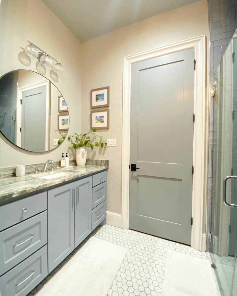 Neutral Bathroom With Blue Cabinets