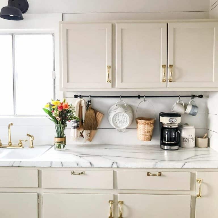 Neutral Farmhouse Kitchen With a Curtain Rod Coffee Mug Rack