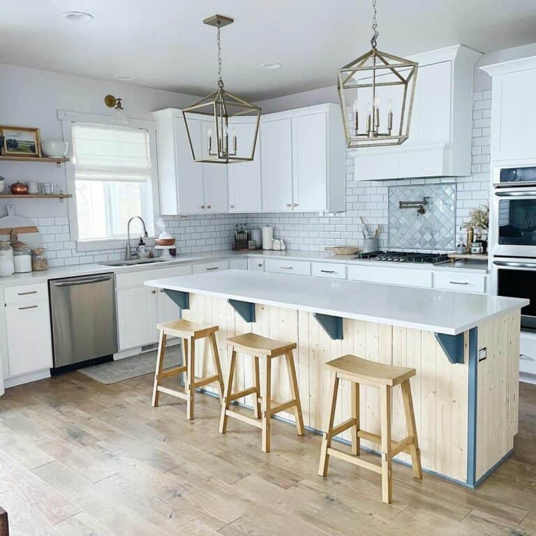 Open-Concept Kitchen With White Counters and Bar Seating