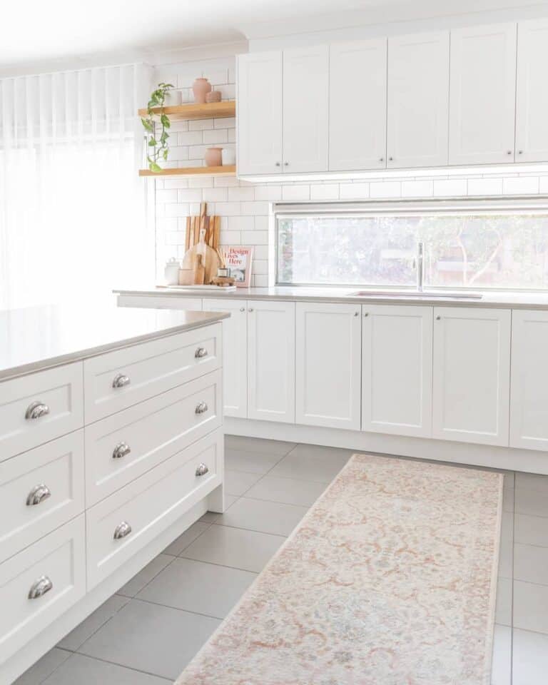 Open Kitchen With Crisp White Cabinets and Wood Shelves