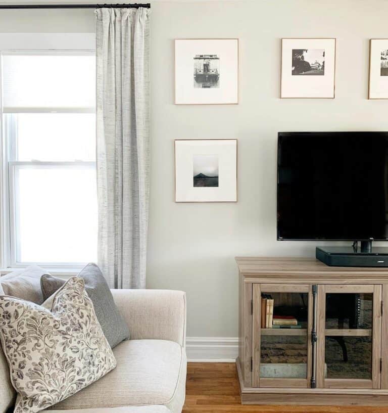 Photos on Wall Behind TV in Farmhouse Living Room