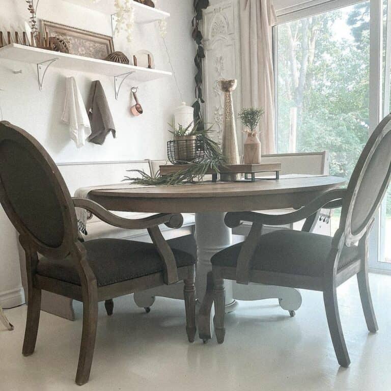 Round Table and Dark Brown Chairs in Dining Room