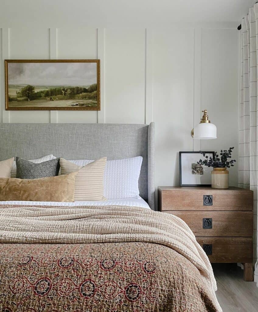 Rustic Nightstand Beside a Gray Wingback Headboard