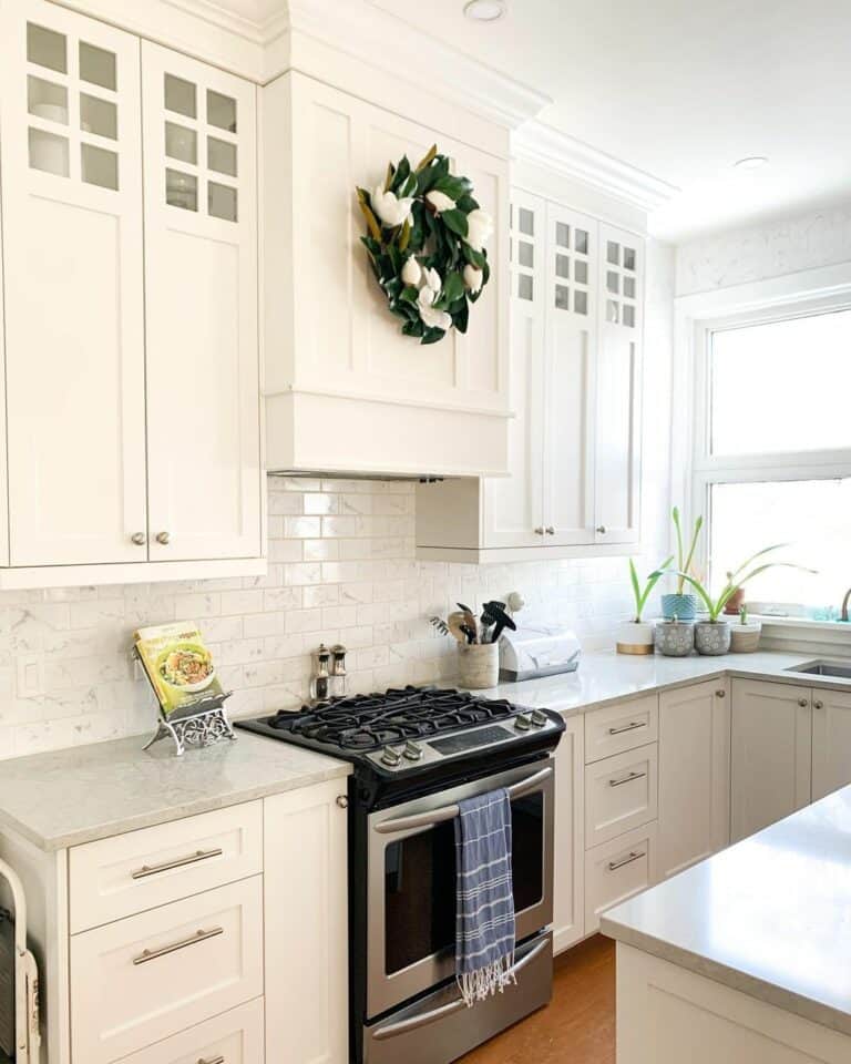 Small Kitchen With White Cabinets and Backsplash