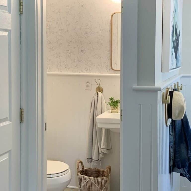 Small White Powder Room With Neutral Floral Wallpaper