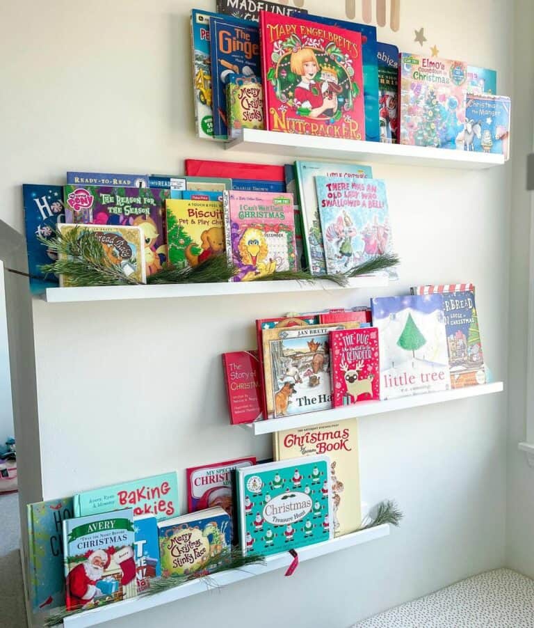 Staggered White Floating Shelves With Kids Books