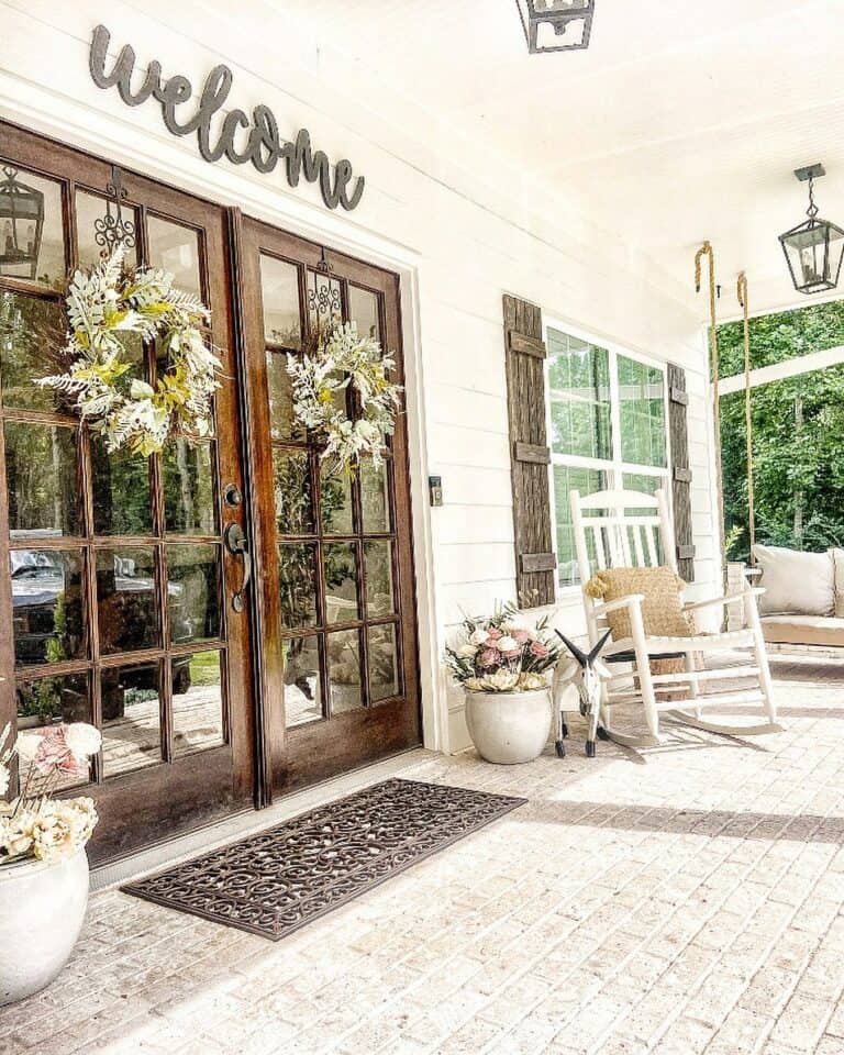Stained Wood Double Doors With Black Entrance Sign