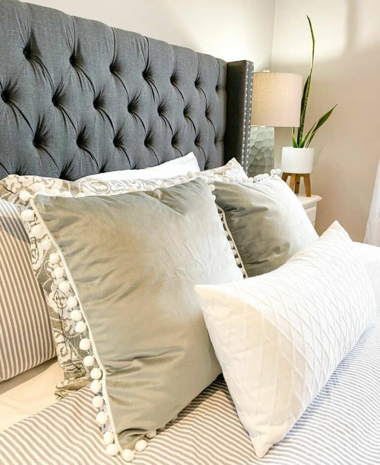 Throw Pillows Lean on a Tufted Headboard