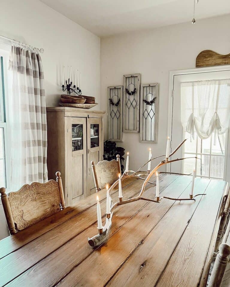 Tree Branch Centerpiece Between Carved Wood Chairs