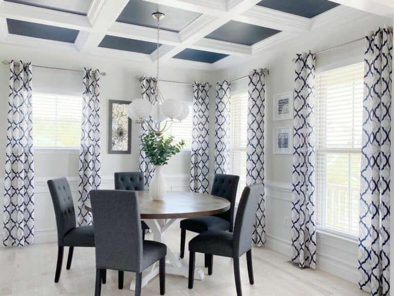 Two-toned White Dining Table With Gray Chairs