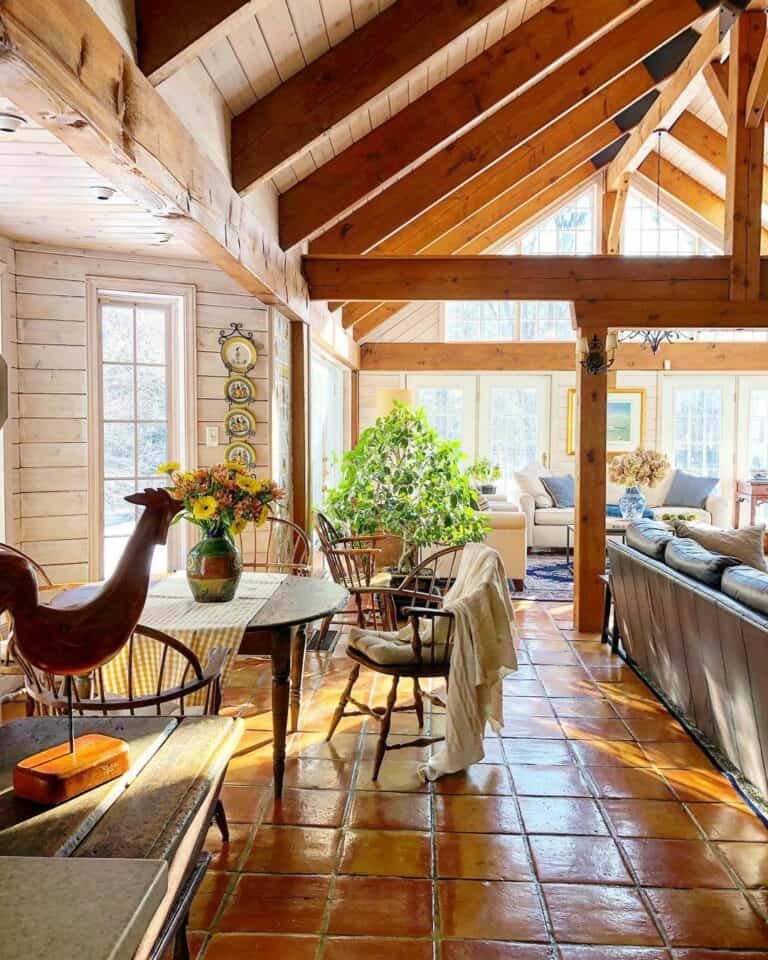 Warm Lodge Living Room With Exposed Trusses and Beams