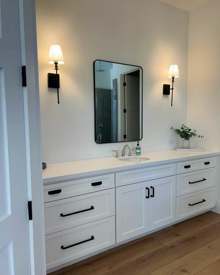 Warm Minimalist Bathroom Aesthetic With Torch Sconces