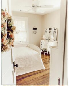 White Antique Bedroom With Hardwood Floors