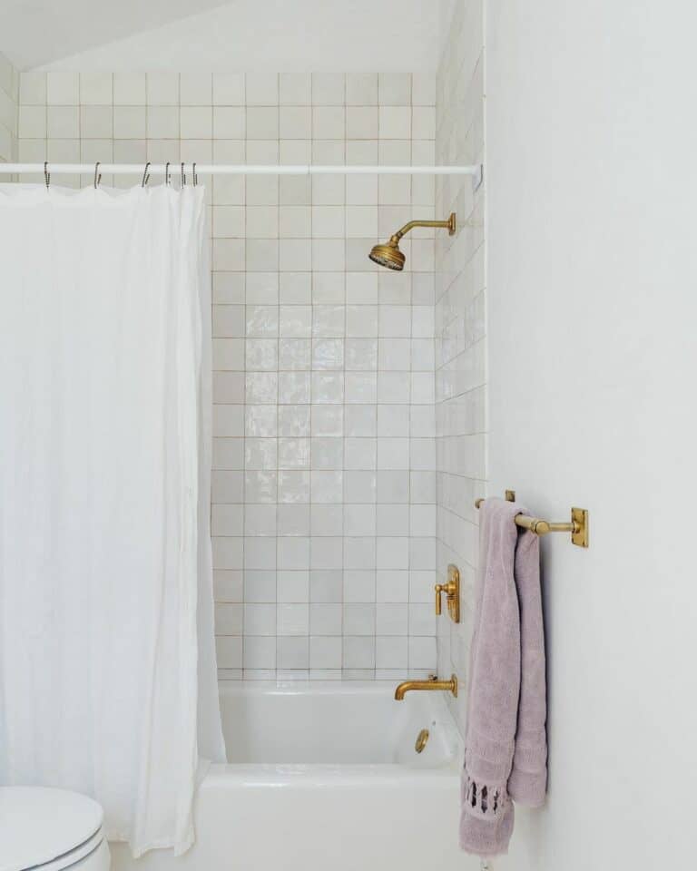 White Bathroom With Feminine Gold and Pink Accents