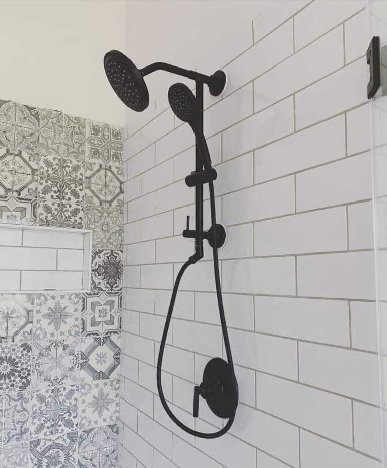 White Bathroom With Patterned Tile Accent