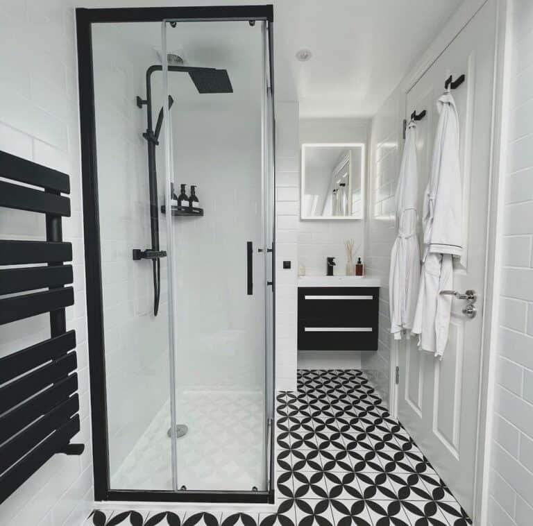 White Ceramic Tile Bathroom With Black Accents