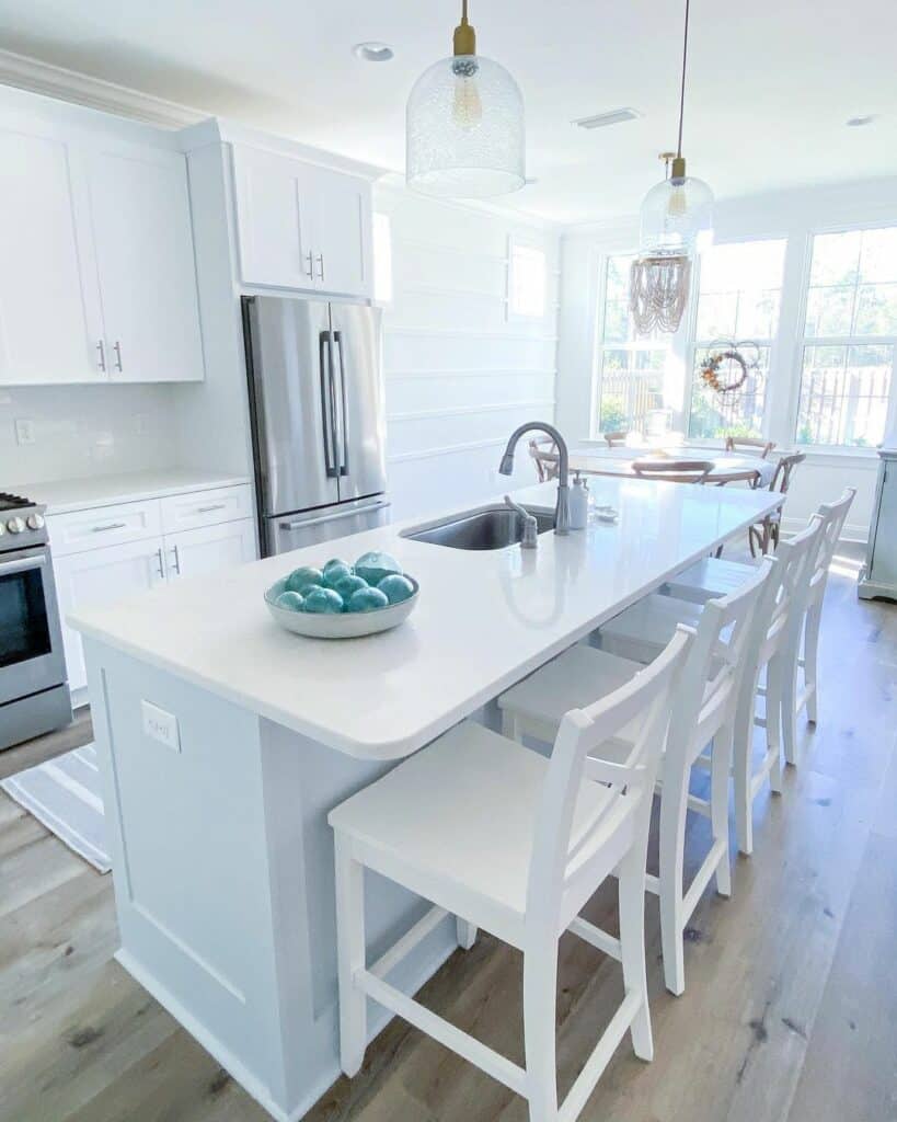White Cottage Kitchen With Glass Pendant Lamps