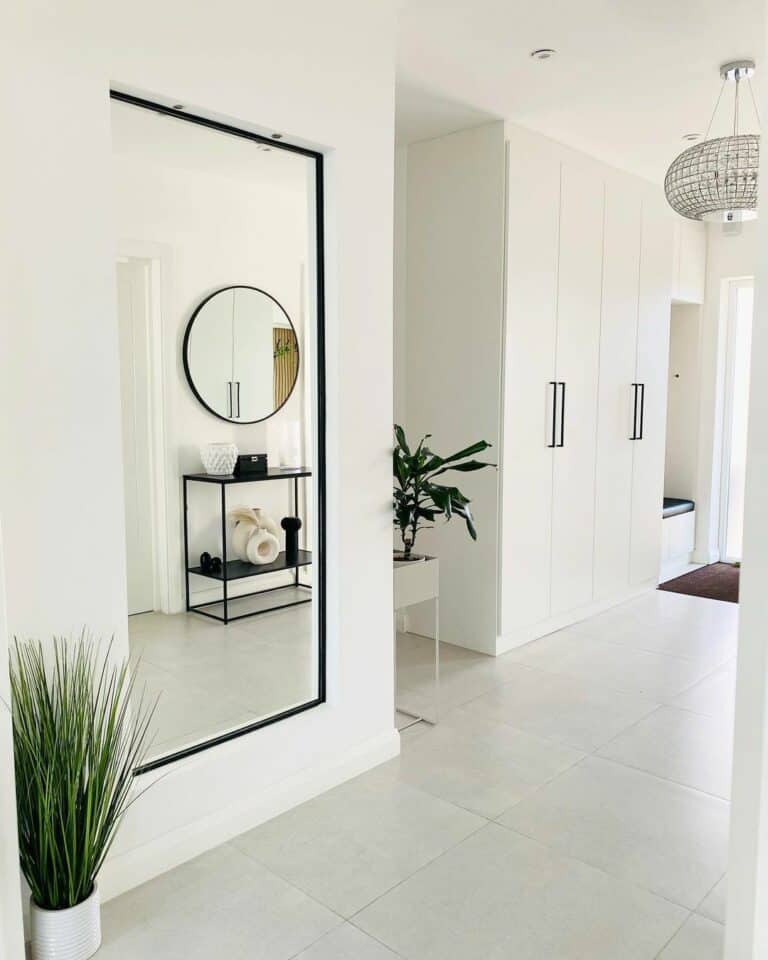 White Entryway With Minimalistic Floor Tiles