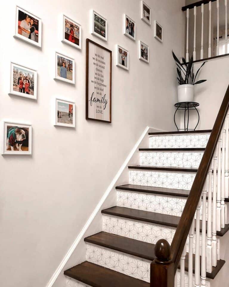 White Framed Photos Along Stairway