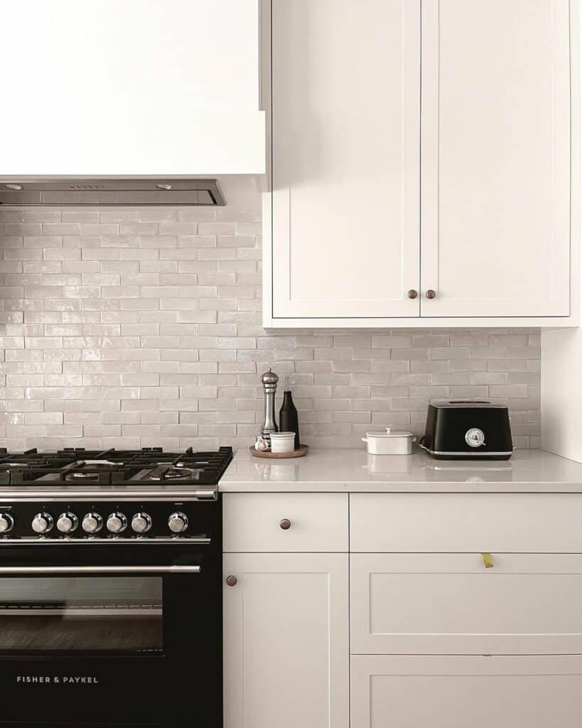 White Kitchen Cabinets With Glossy Gray Tile Backsplash
