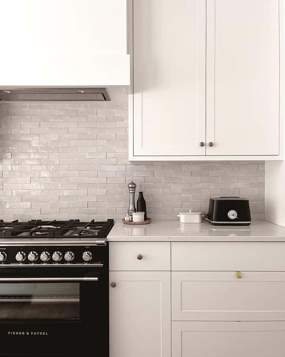 White Kitchen Cabinets With Glossy Gray Tile Backsplash - Soul & Lane