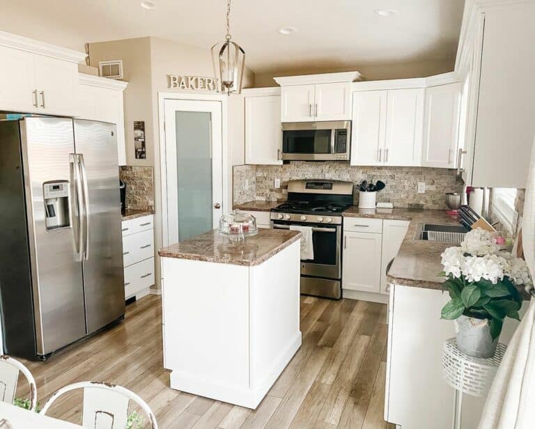 White Kitchen With Ashy Toned Wood Floors and Backsplash