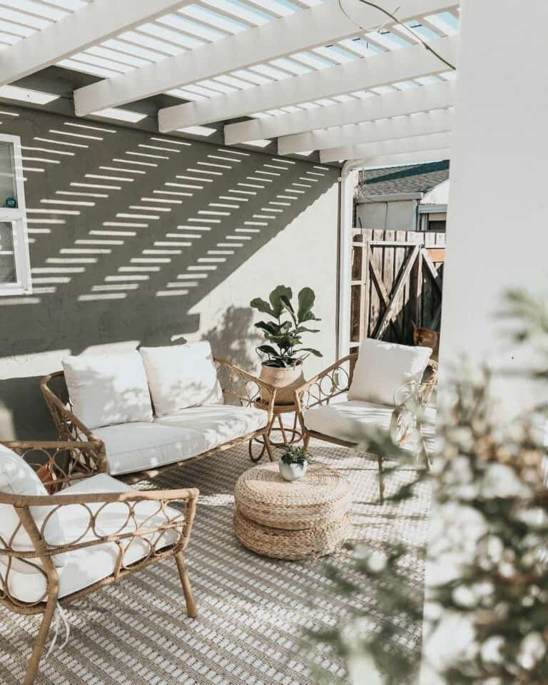 White Pergola With Rattan Outdoor Chairs