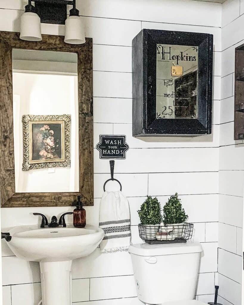 White Shiplap Bathroom With Black Towel Ring