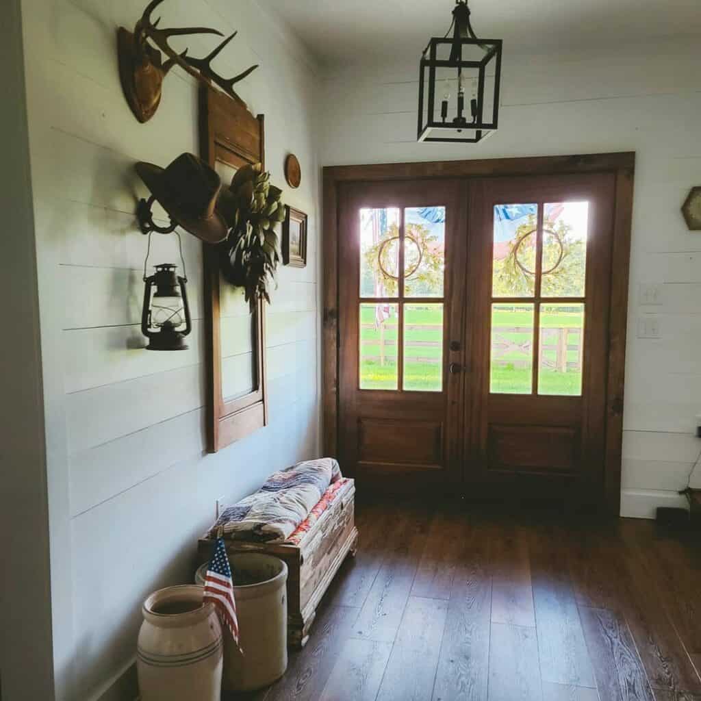 White Shiplap Entry With Stained Wood Double Doors