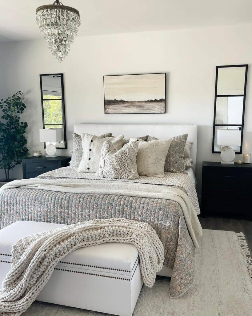 White and Black Bedroom With Gray Floral Bedspread