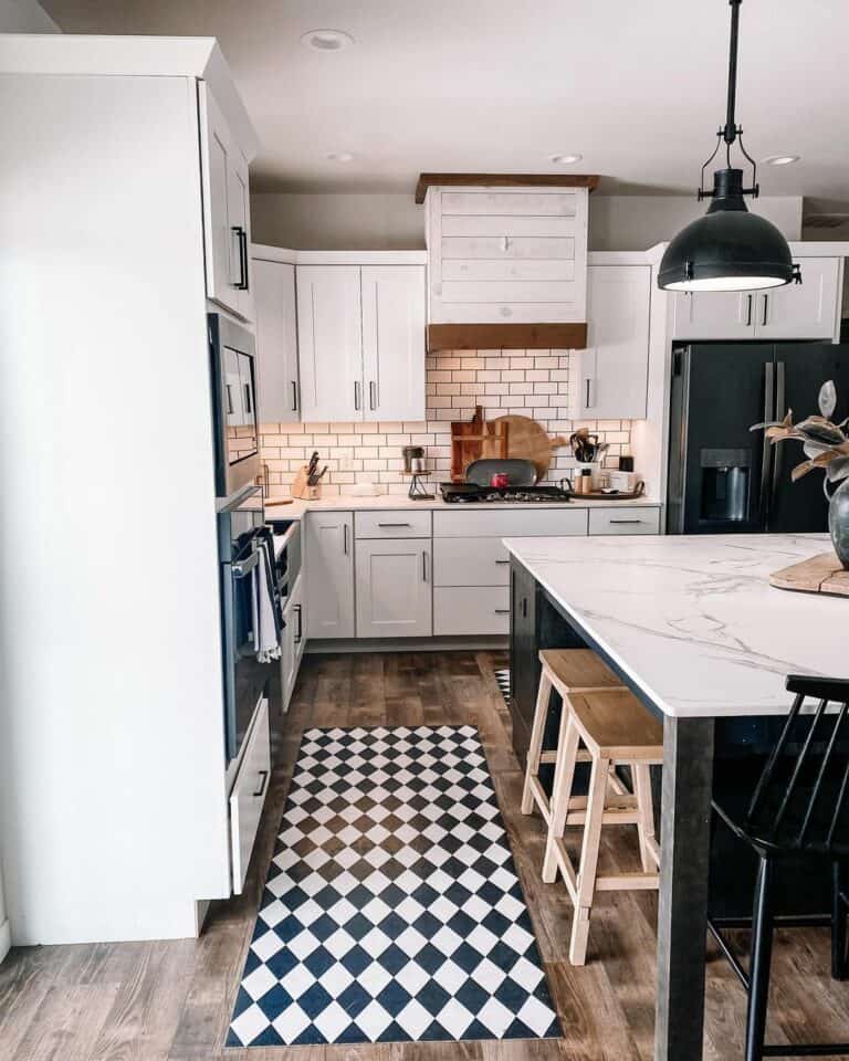 White and Black Kitchen With Oversized Marble Island