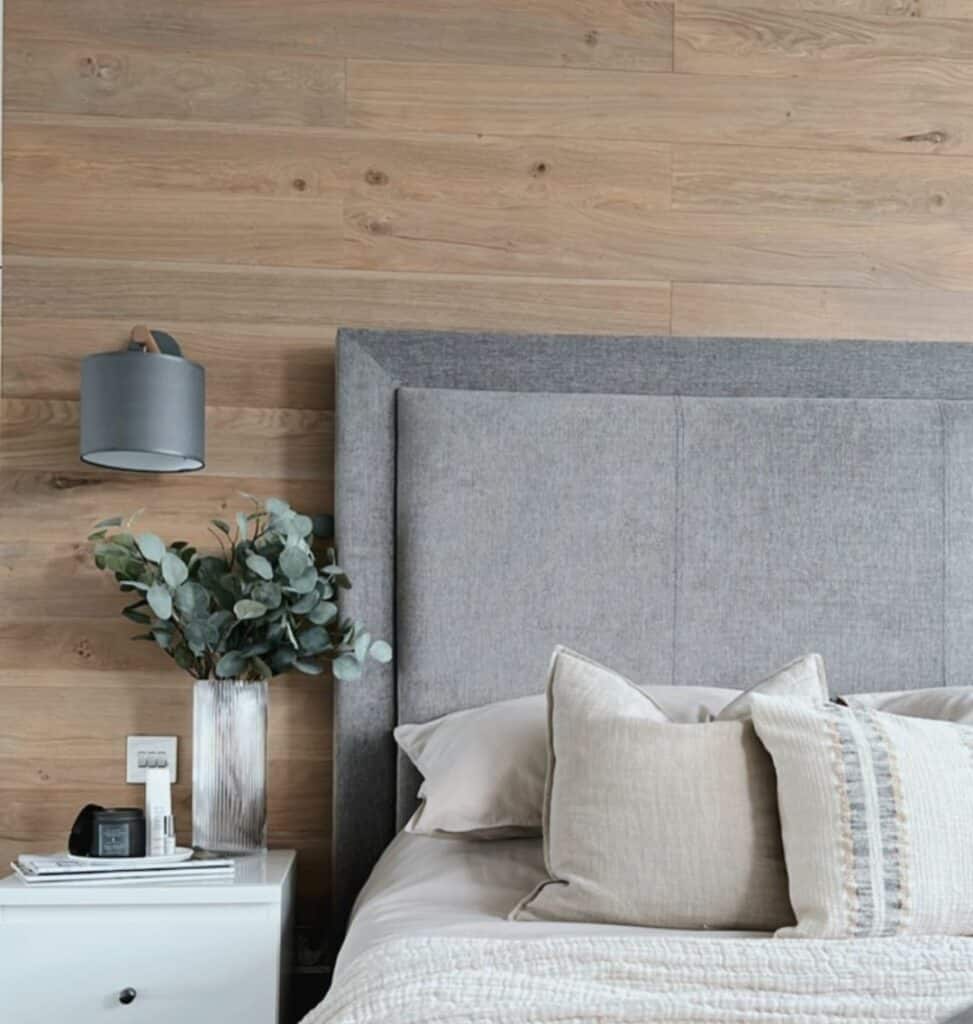 Wood Accent Wall Hosts Metal Sconce