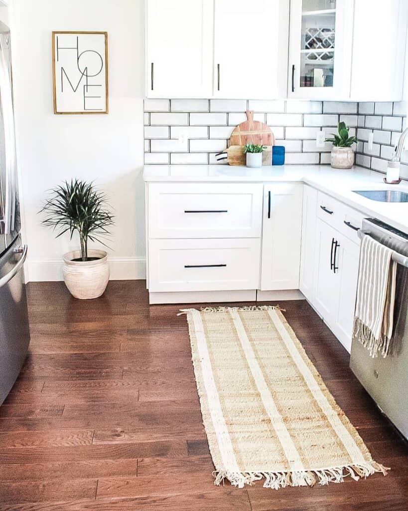 Wood Flooring Accompanied by a Tasseled Mat