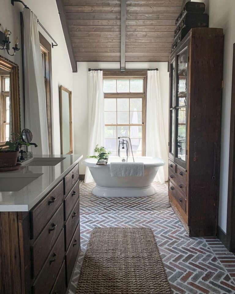 Wood and White Bathroom With Herringbone Brick Floors