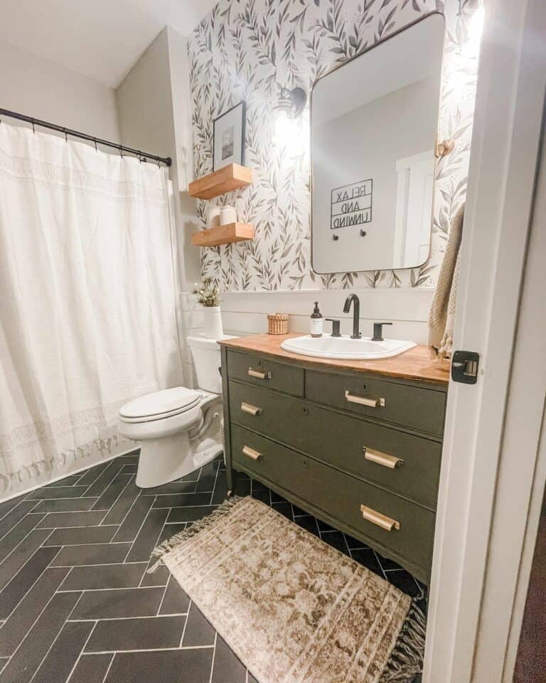 Bathroom With Black Herringbone Flooring and Olive Accents