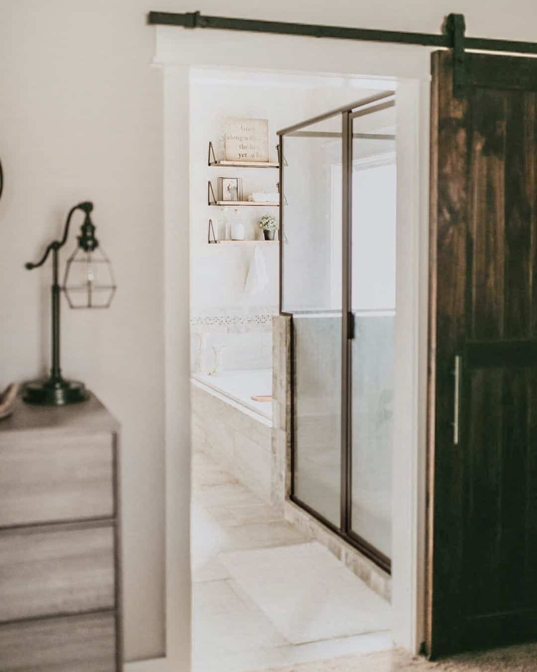 Bathroom With Dark Stained Wood Sliding Door - Soul & Lane